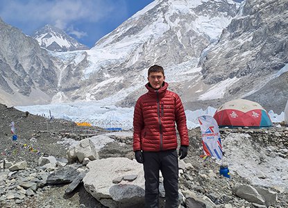 Ioan Jones stands as Everest Base Camp.jpg