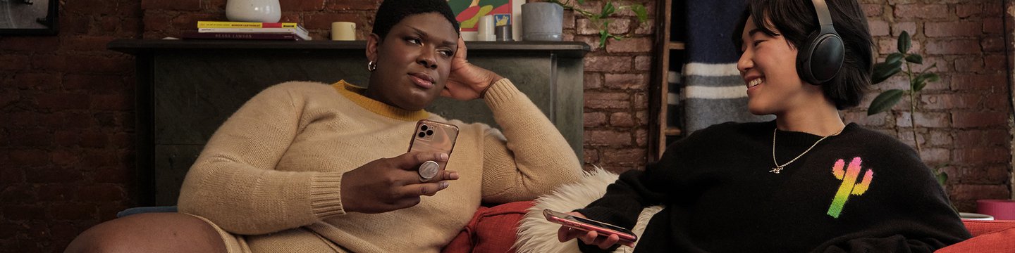 A non-binary trans woman and a non-binary person enjoying time on the couch.jpg