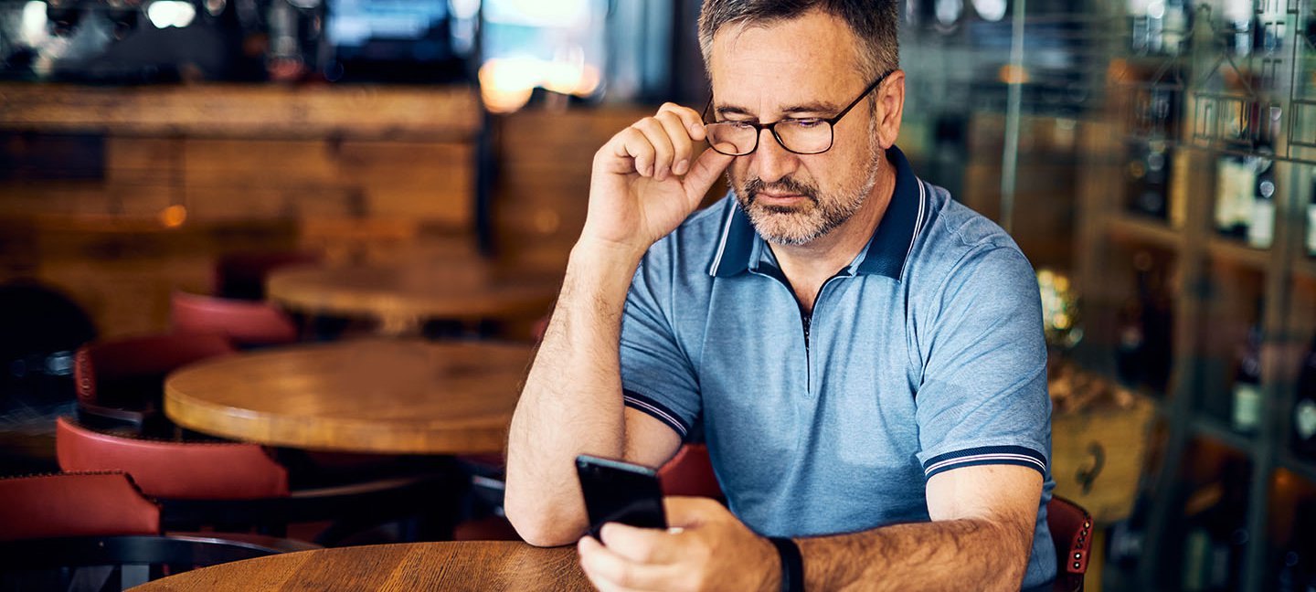 Older man texting.jpeg