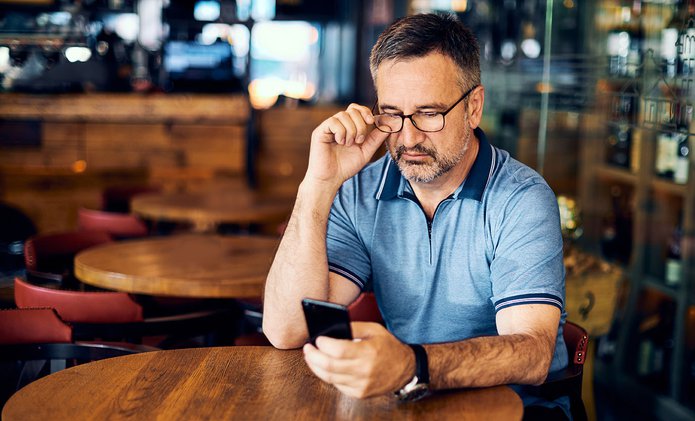 Older man texting.jpeg