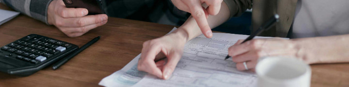 hands-of-two-people-filling-out-form.png