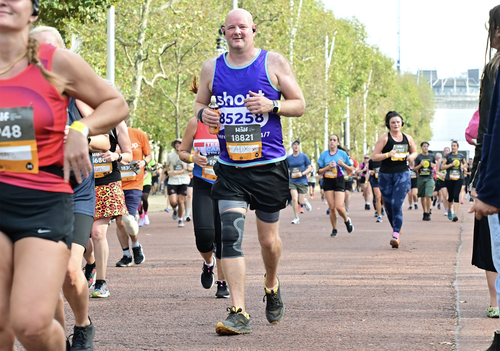 Adrian running Royal Parks Half in Shout vest.png